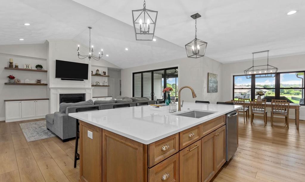 modern whit kitchen with black dual ovens